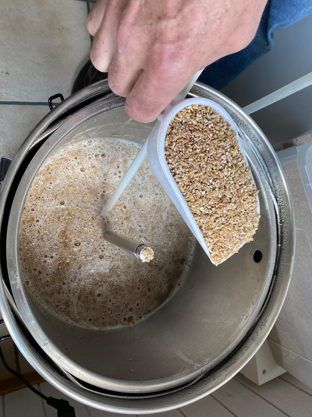 Gerhard adding malt to the Grainfather at his Swiss brewery