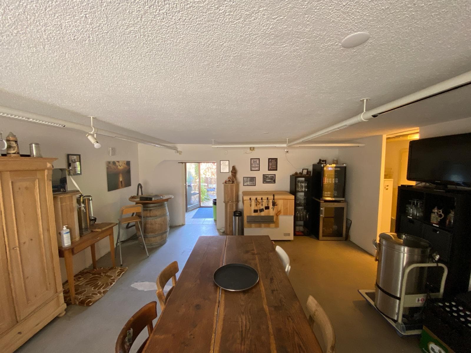 The eibachbraui tasting room with long wooden table and tap station